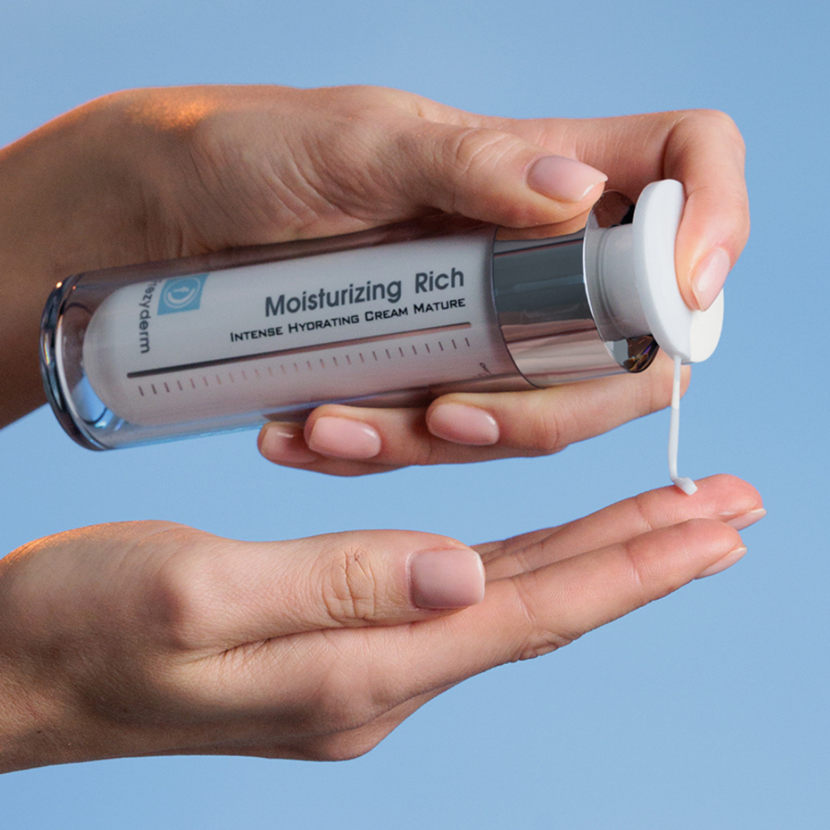 FREZYDERM Moisturizing Rich Cream being dispensed into a hand
