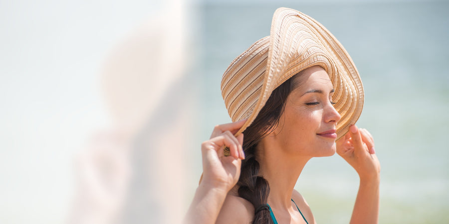 Woman wearing a sunhat outdoors